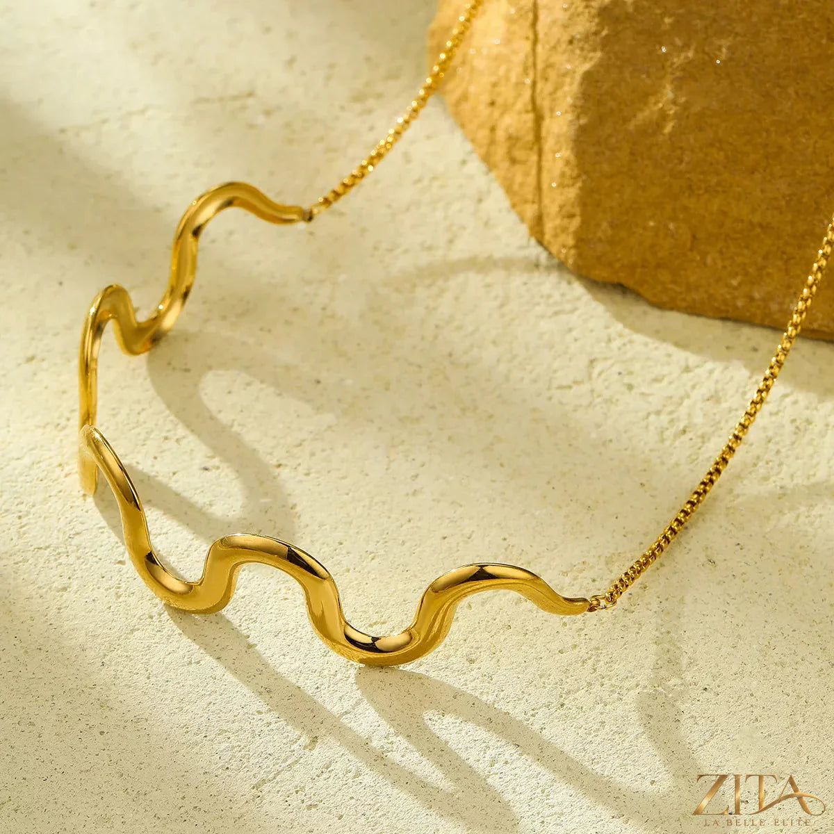 18K gold-plated wave necklace by Zita La Belle Elite featuring a sleek, flowing ocean-inspired design on a delicate chain.