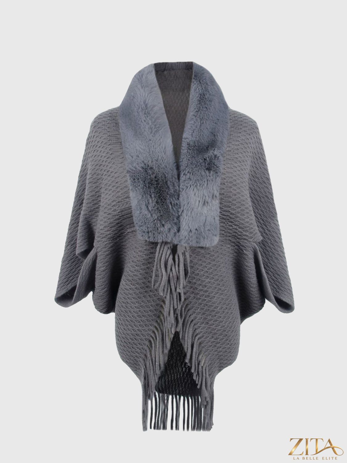 Open front fringe hem poncho from Trendsi featuring a flowing design and stylish fringe trim.