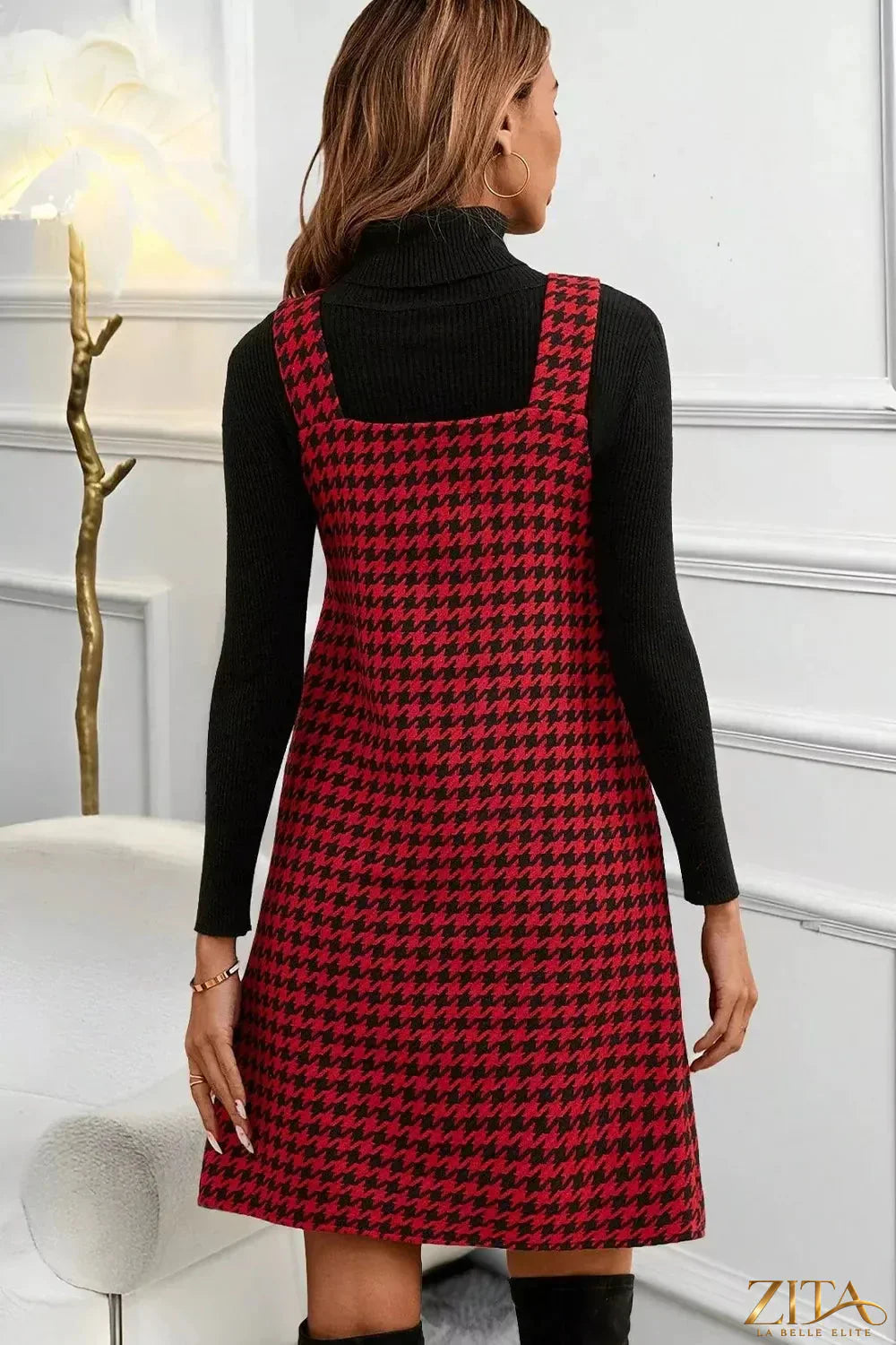 Houndstooth V-neck sleeveless mini dress by Trendsi, featuring a fitted silhouette and classic black and white pattern.