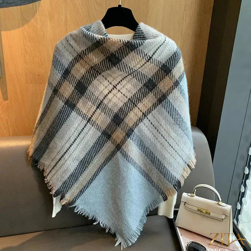 Raw hem plaid scarf by Trendsi, featuring soft fabric, fringed edges, and classic plaid pattern for stylish layering.