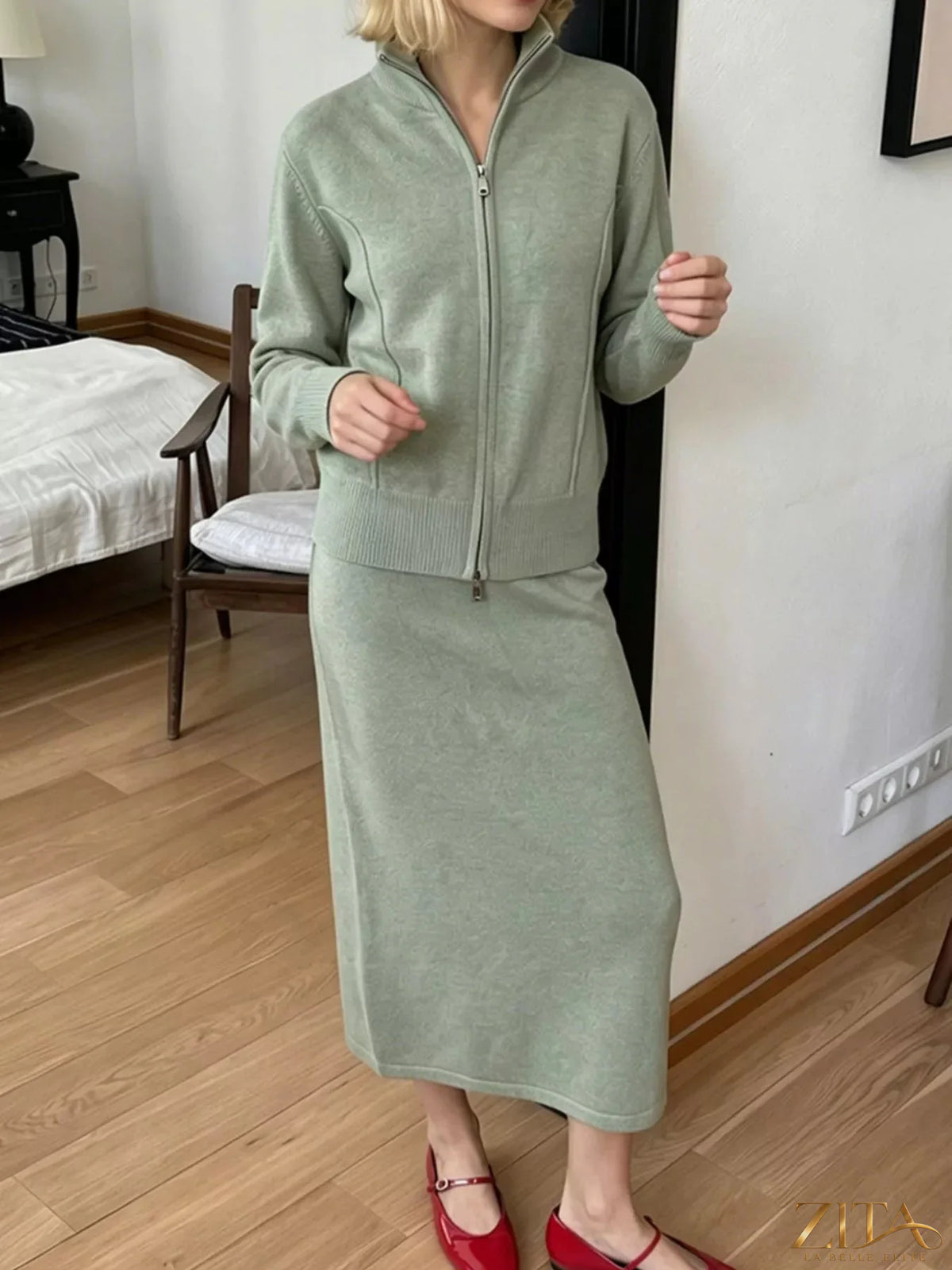 Zita La Belle Elite zip-up mock neck cardigan and matching midi skirt sweater set, shown in a coordinated knit ensemble.