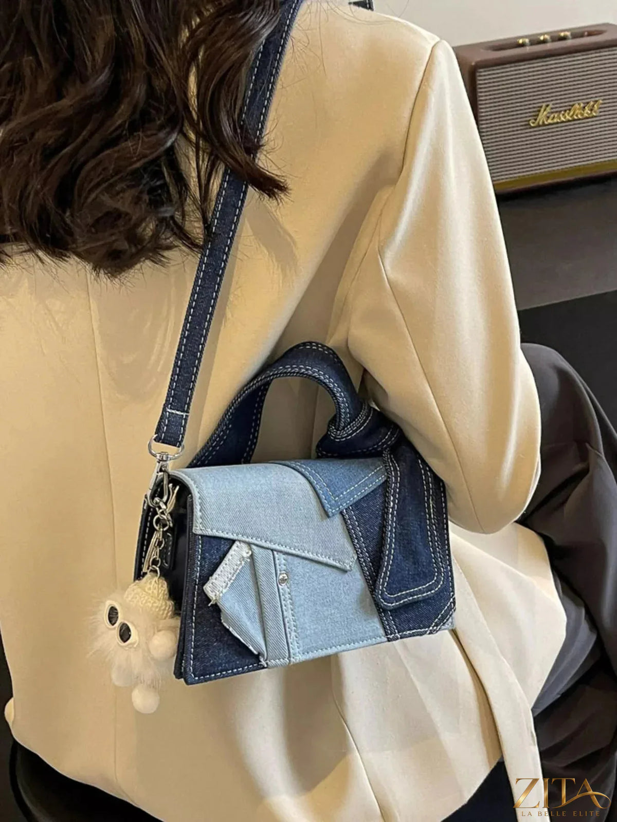Zita La Belle Elite denim patchwork crossbody bag with colorful fabric patches and adjustable strap on a white background.