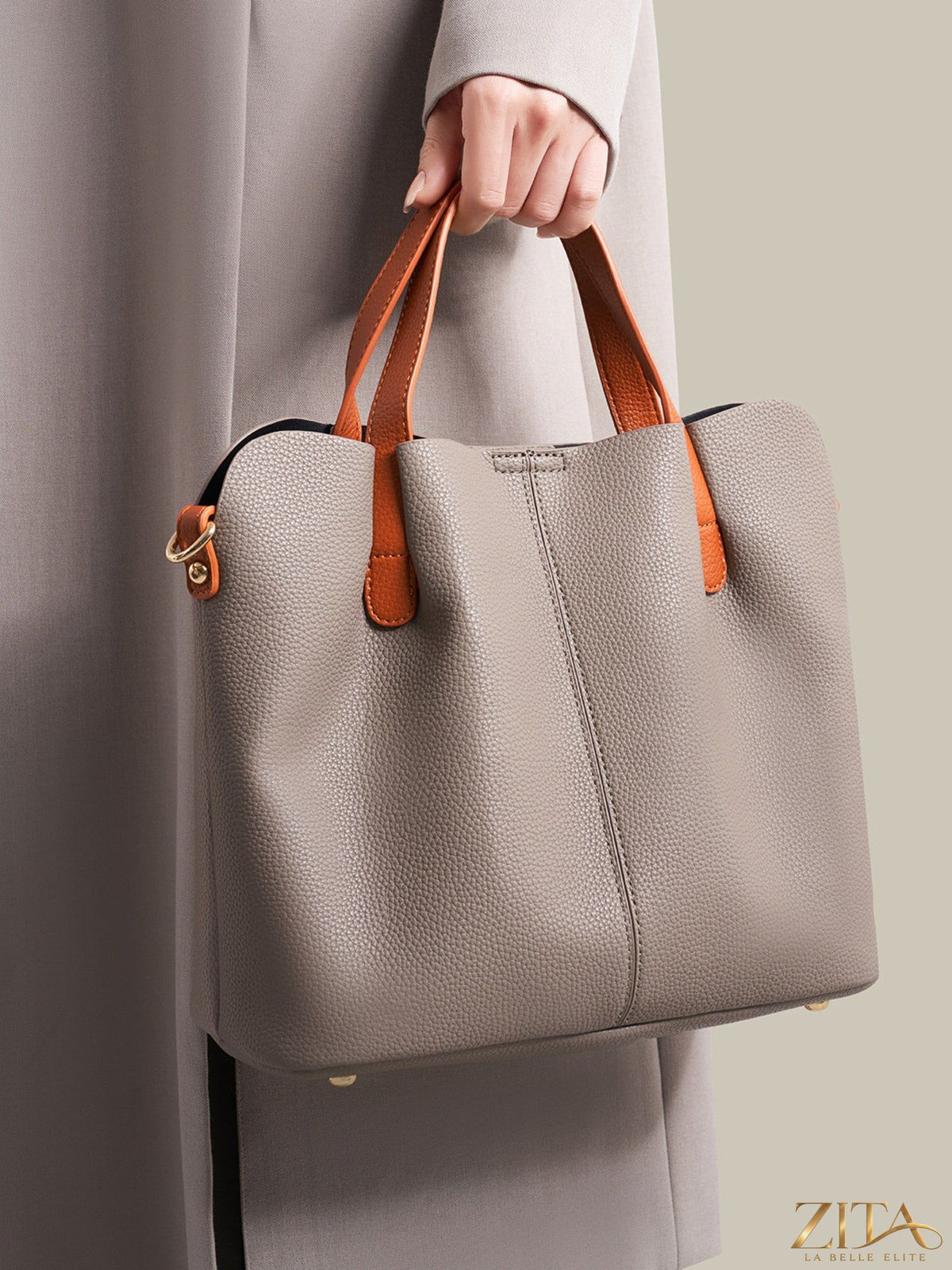 Leather contrast handle handbag with sleek design and stylish details, perfect for trendy everyday wear by Trendsi.