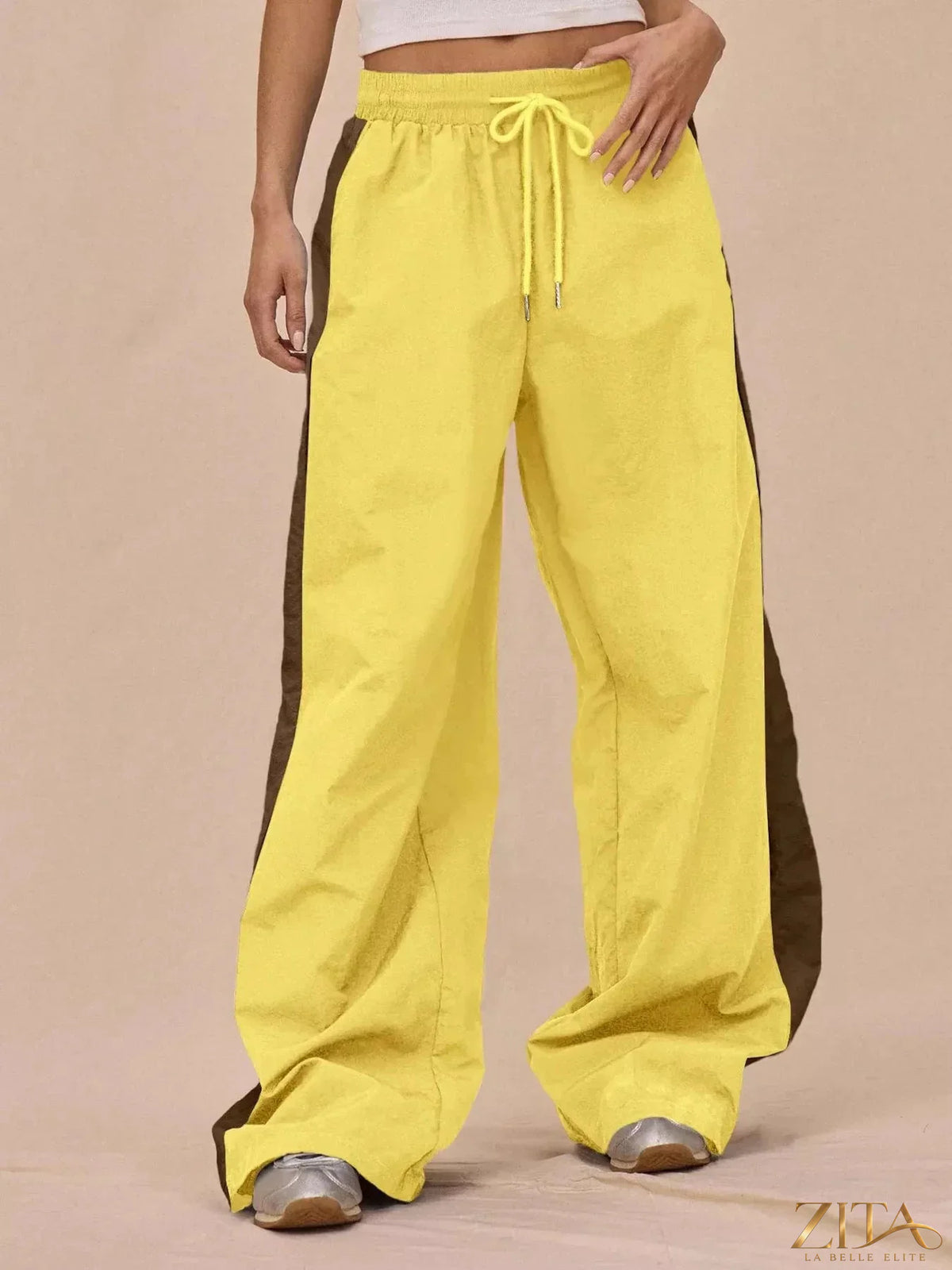 Color-block Zita La Belle Elite tracksuit and wide-leg pants set, featuring vibrant color panels and comfortable fit.