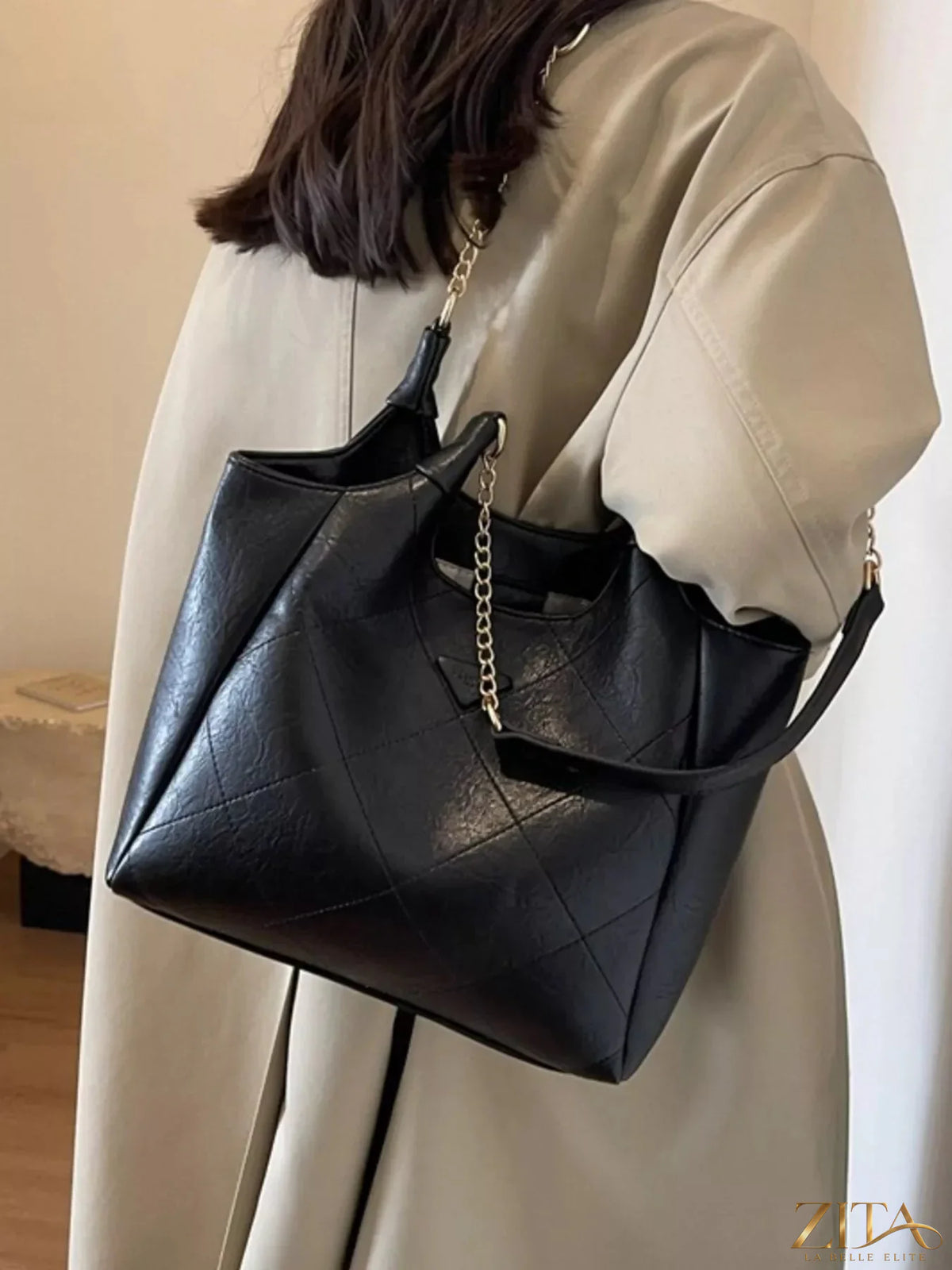Black PU leather shoulder bag with adjustable strap and silver hardware, stylish Trendsi accessory for everyday use.