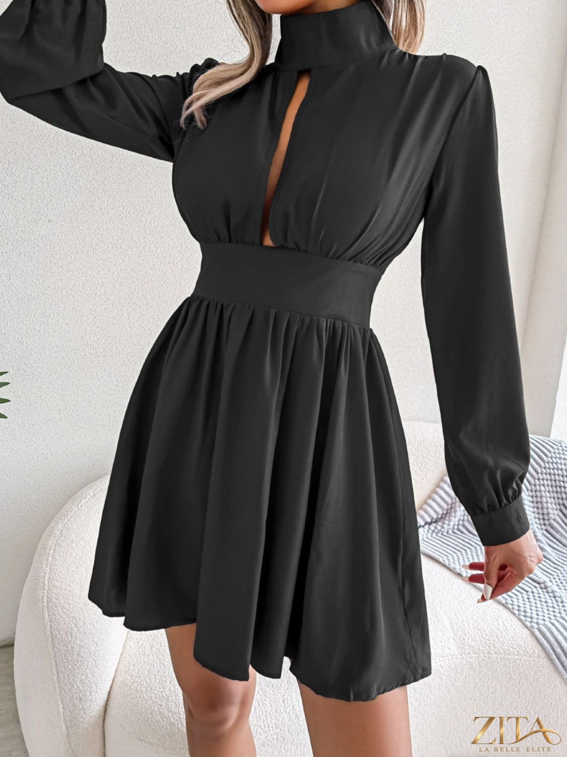Trendsi cutout turtleneck A-line mini dress, featuring a stylish silhouette and modern design, shown on a model.