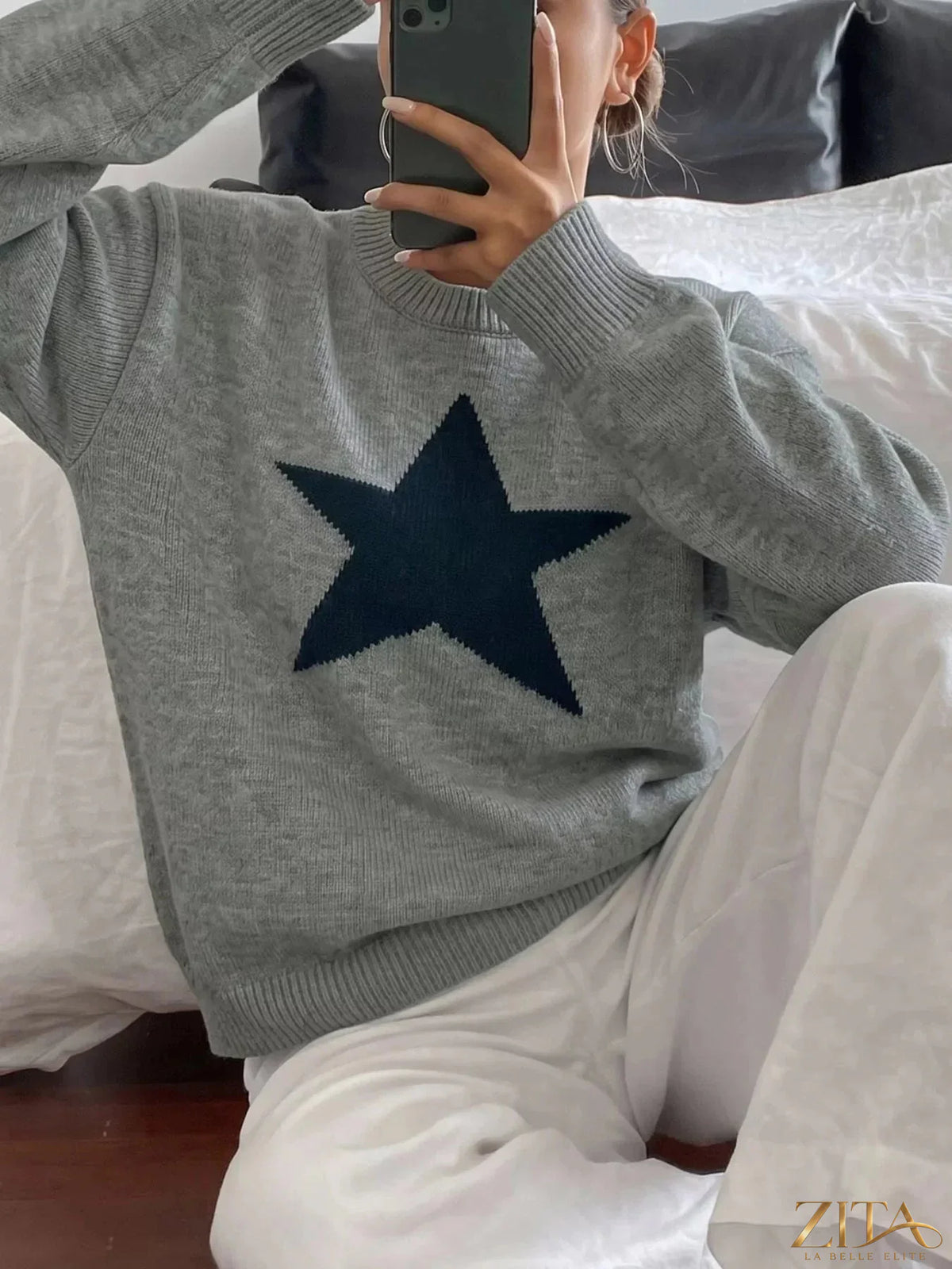 Star-patterned dropped shoulder sweater by Zita La Belle Elite, featuring a cozy knit with star designs and relaxed fit.