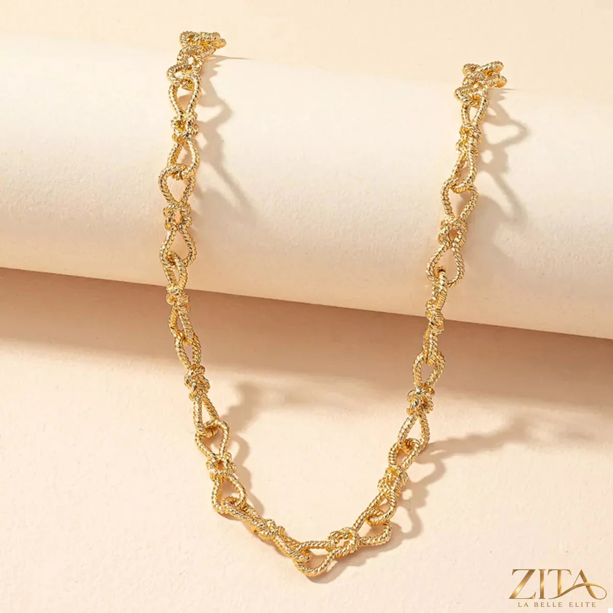 18K gold-plated chain link necklace by Zita La Belle Elite, showcasing a close-up of the elegant, shiny jewelry links.