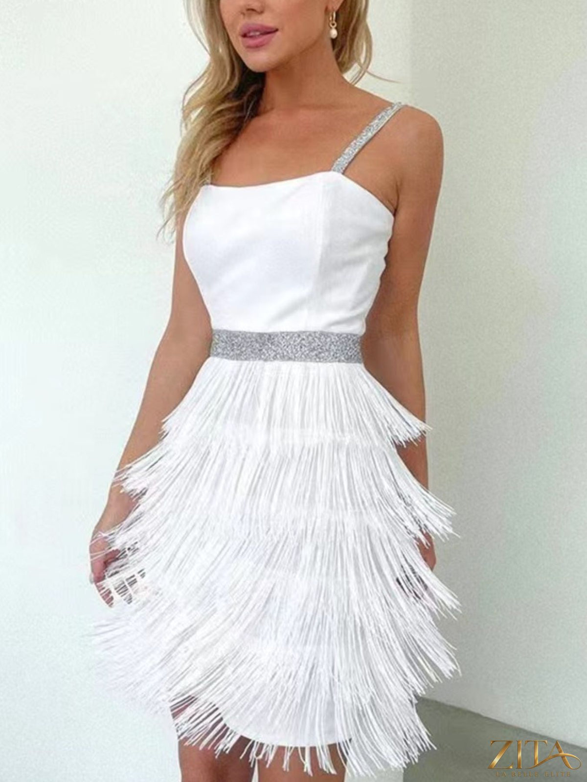 Trendsi fringe trim cami mini dress featuring a sleeveless design with decorative fringe detail on the hem.