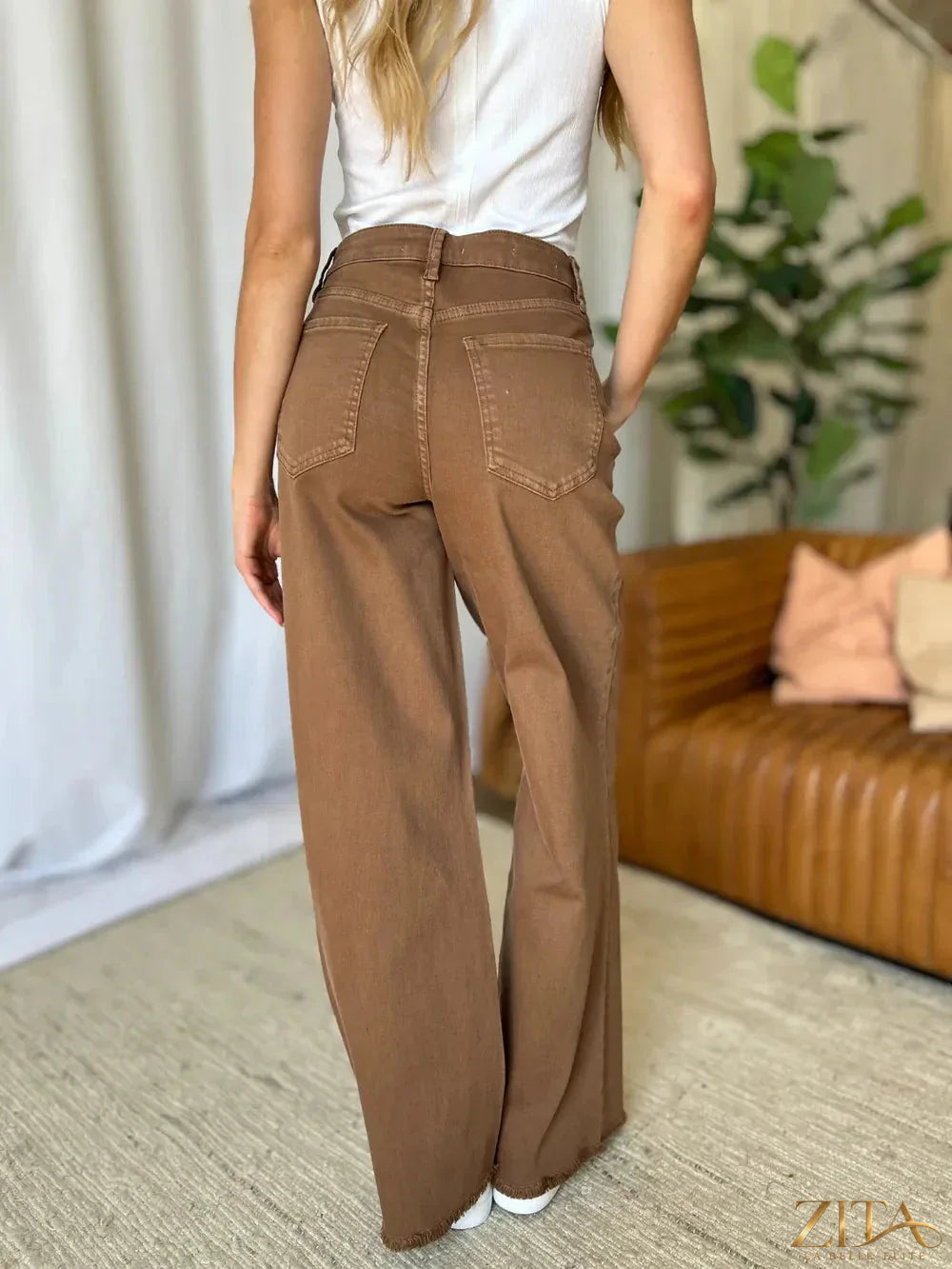 Zita La Belle Elite RFM full size high rise garment dye wide leg jeans displayed on a model, showcasing their relaxed fit and denim texture.