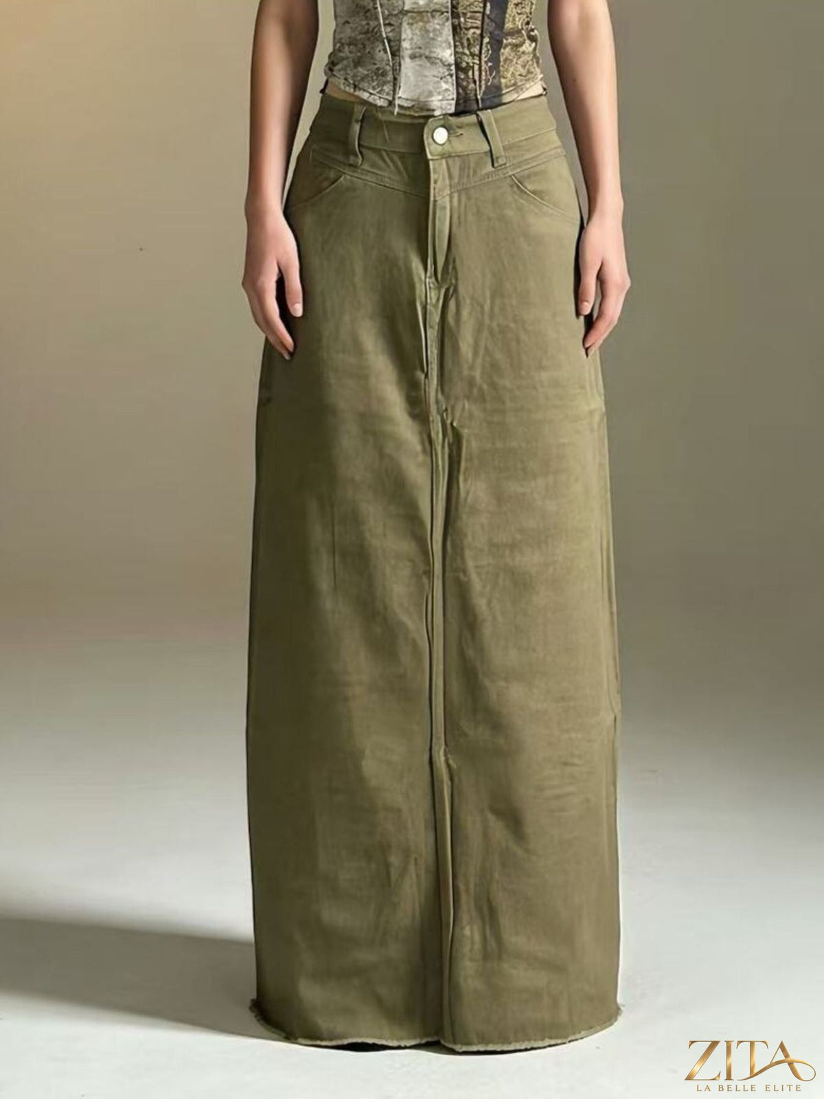 Raw hem maxi denim skirt by Zita La Belle Elite, featuring a flowing silhouette and distressed raw hem detail.