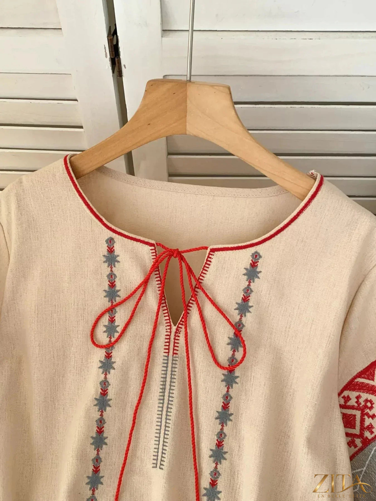 Zita La Belle Elite embroidered tie neck blouse featuring intricate embroidery and a stylish tie detail at the neckline.