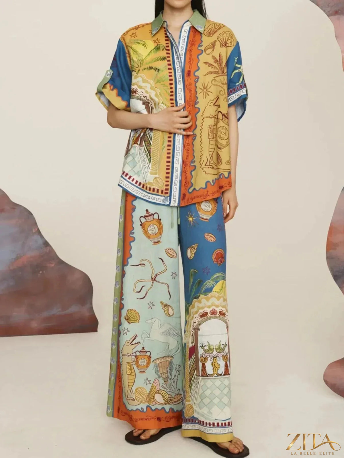 Zita La Belle Elite printed button-up shirt and matching pants set displayed on a mannequin. Stylish, coordinated fashion ensemble.