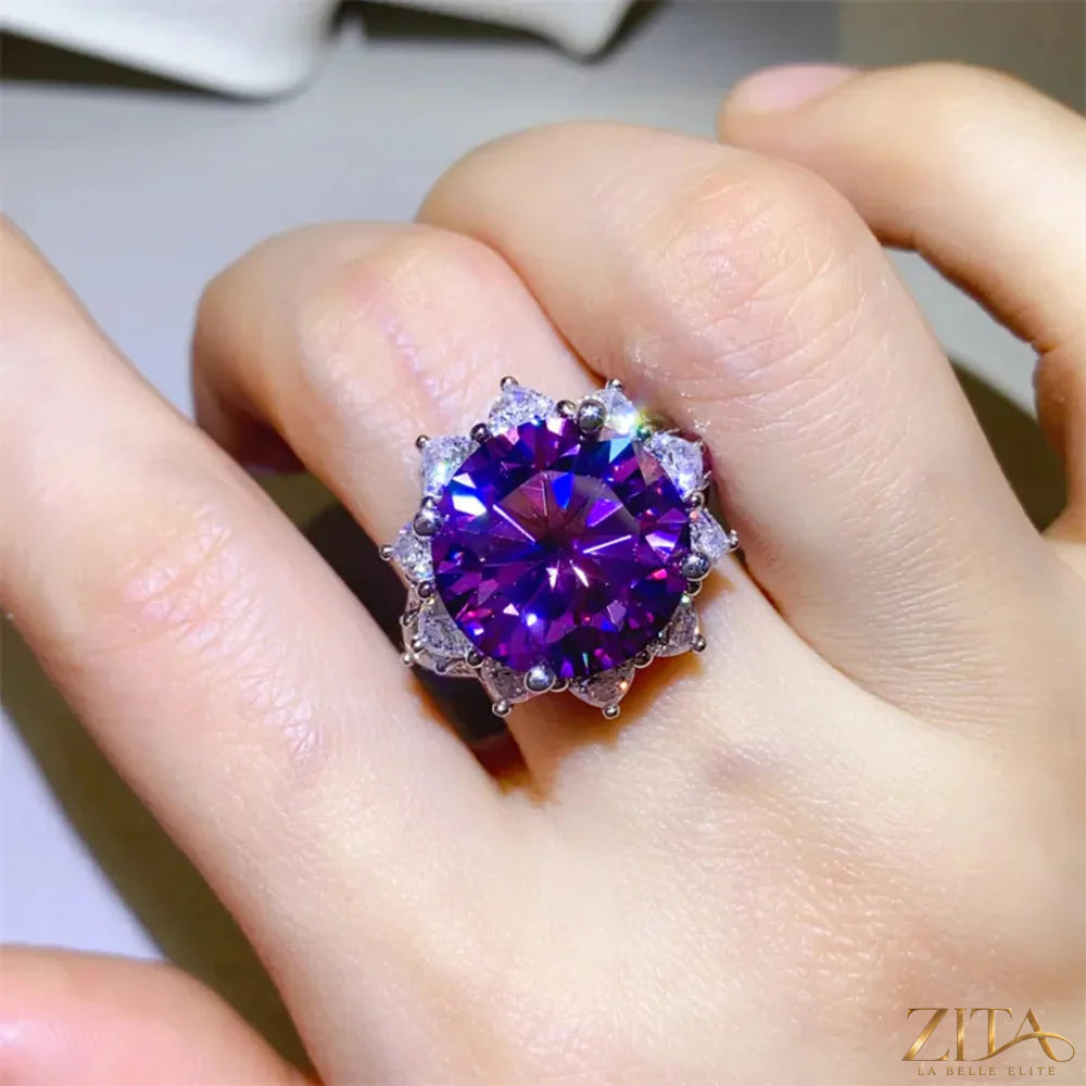 Sterling silver flower-shaped ring with a 10-carat moissanite gemstone, showcasing intricate petal detailing and sparkling brilliance.