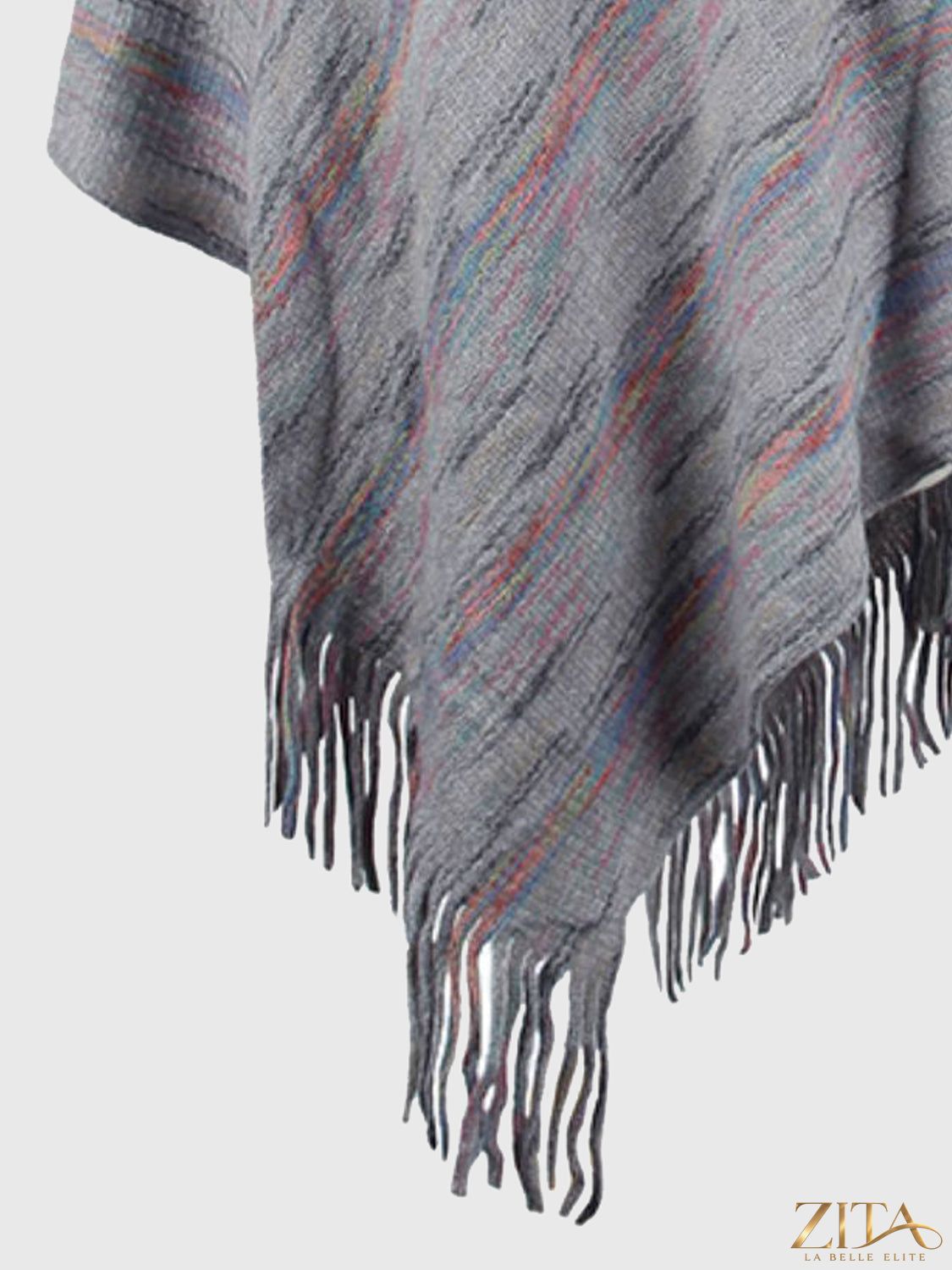 Zita La Belle Elite fringe hem hooded poncho with flowing fabric and stylish fringe details, perfect for layered winter outfits.