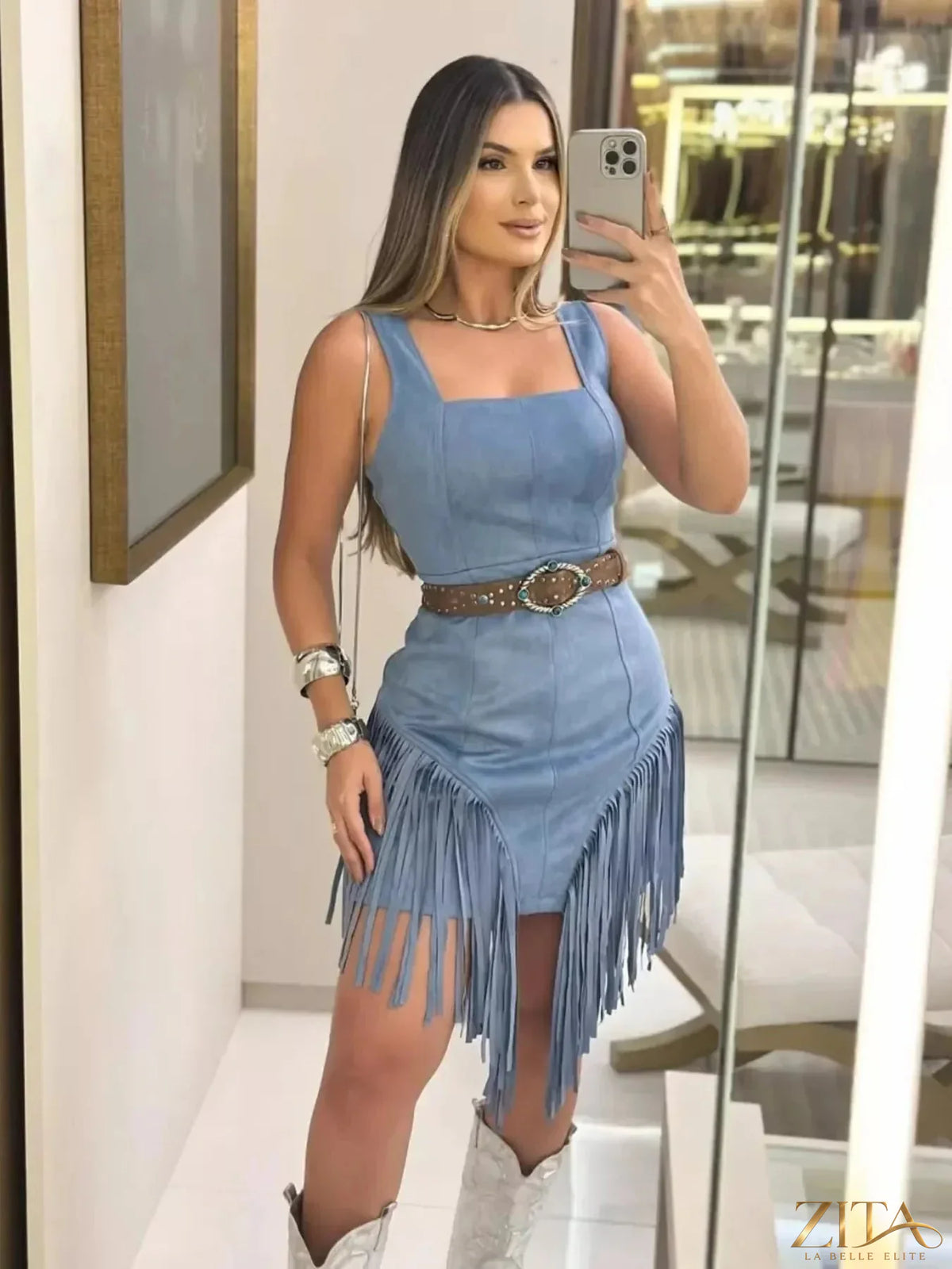 Zita La Belle Elite sleeveless fringed mini dress with flowing fringe details on a model showing the dress's style and fit.