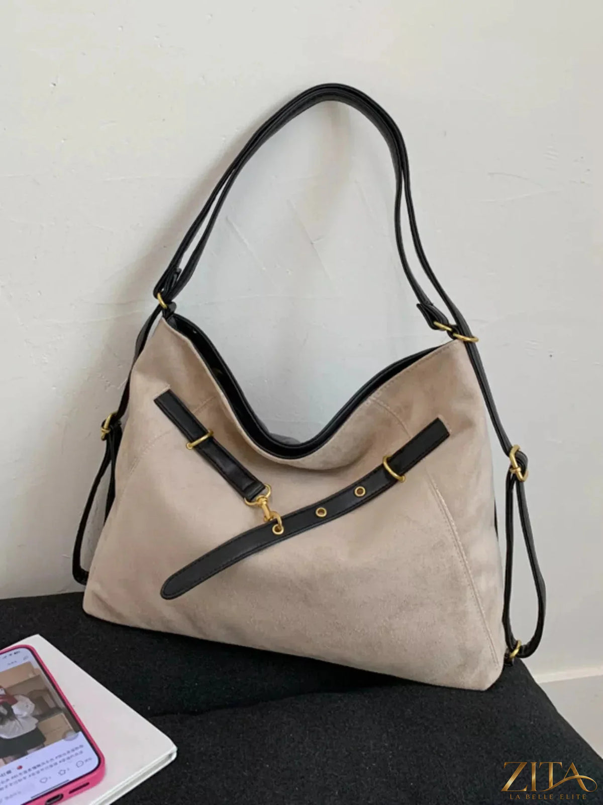Zita La Belle Elite adjustable strap handbag with decorative charm, featuring a stylish design and a versatile carry option.