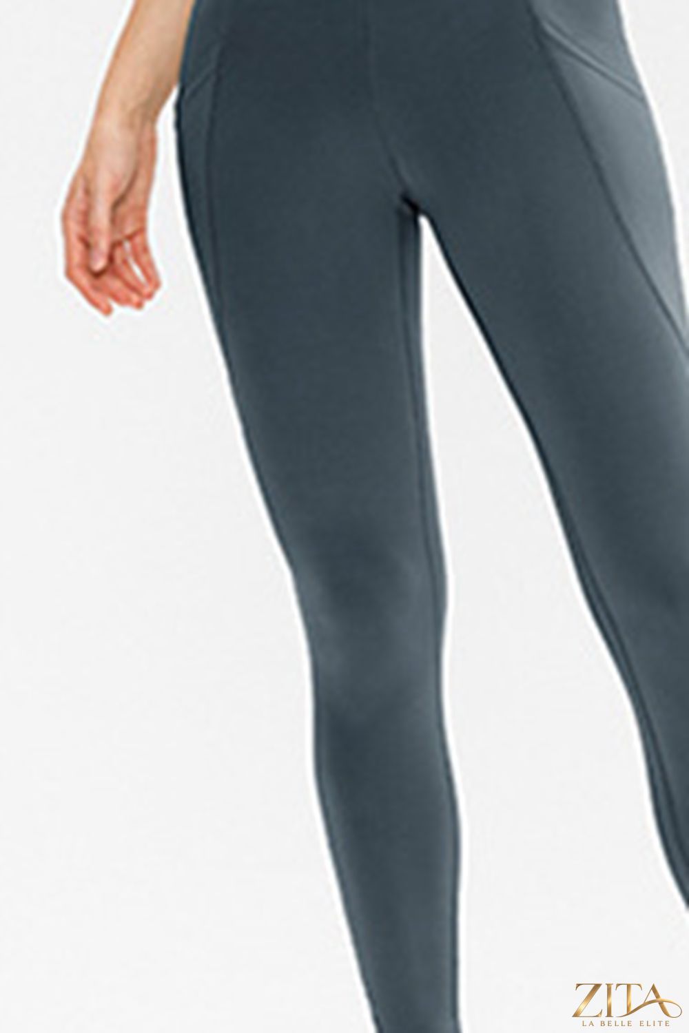 Slim fit long active leggings with pockets from Trendsi, featuring a sleek design ideal for workouts and casual wear.