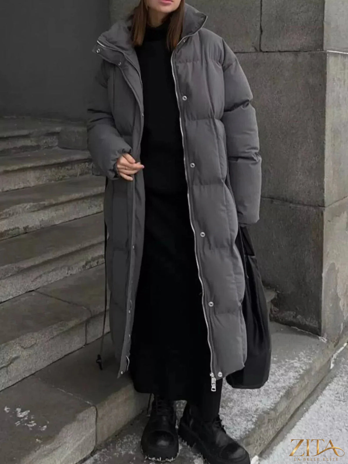 Longline padded winter coat with belt by Zita La Belle Elite, featuring a warm, stylish design and a sleek silhouette.