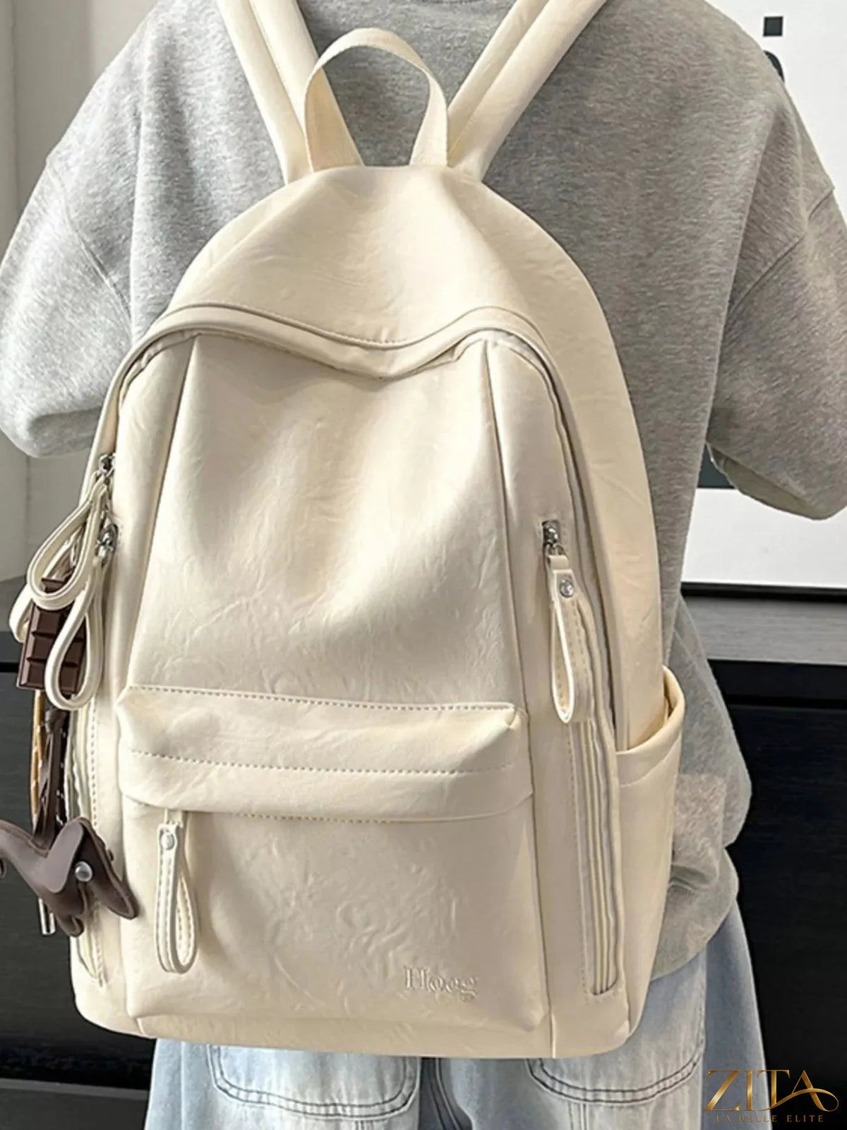 Leather texture backpack bag featuring a sleek design and adjustable straps, ideal for daily use and stylish storage.