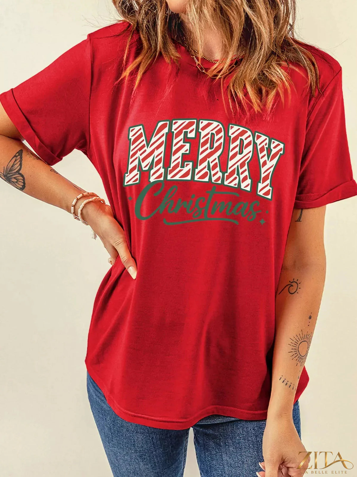 Red Merry Christmas short sleeve graphic tee by Trendsi featuring festive holiday design and cheerful holiday message.