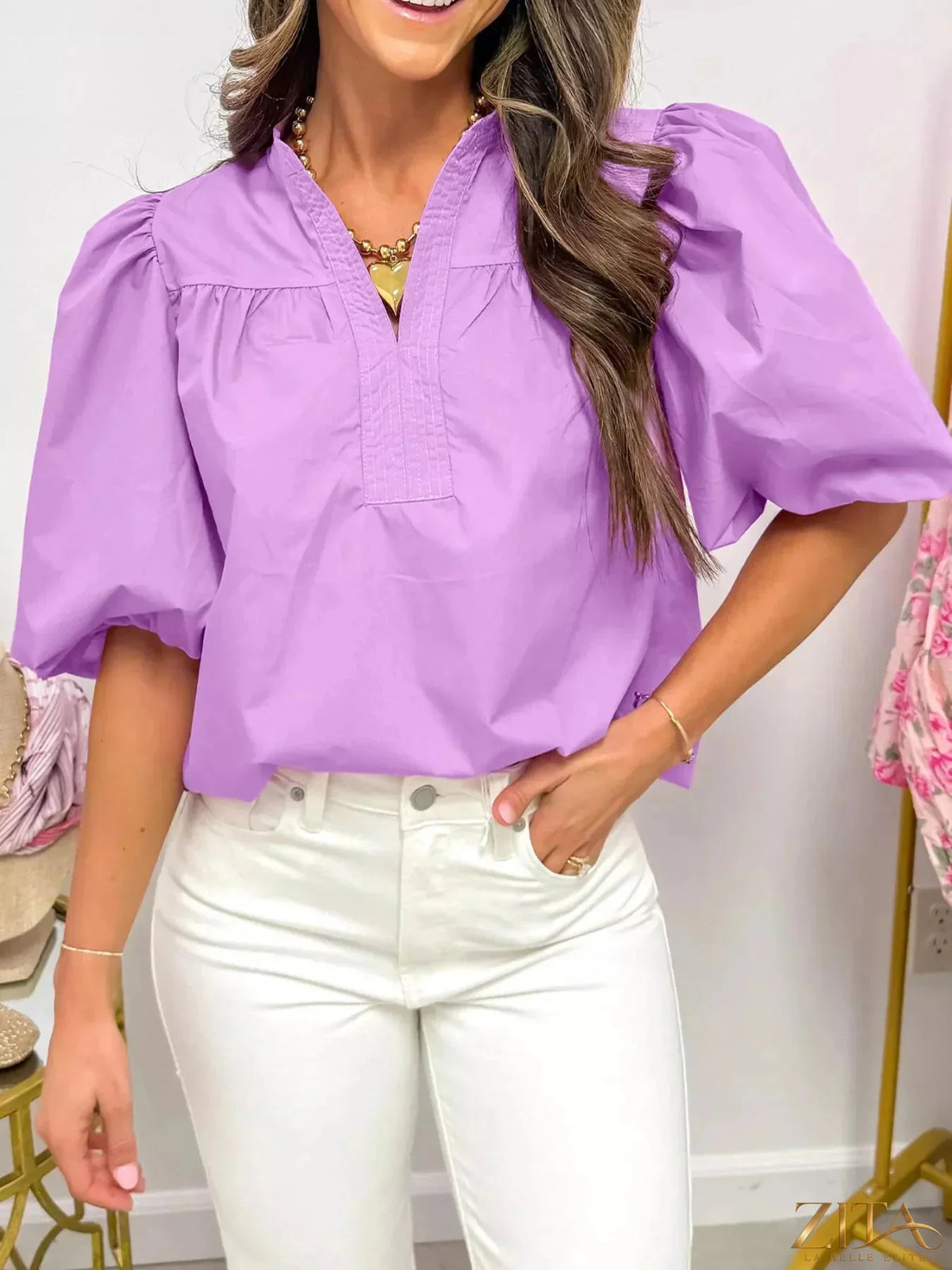 Zita La Belle Elite notched puff sleeve blouse featuring stylish ruffle details and a fitted silhouette on a white background.