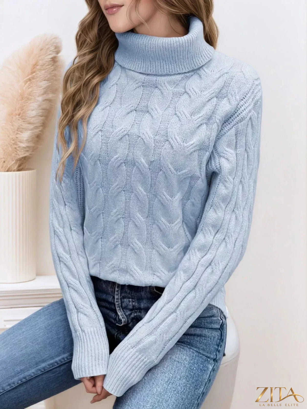 Zita La Belle Elite cable-knit turtleneck sweater in soft, cozy fabric, featuring a classic ribbed turtleneck and textured knit pattern.