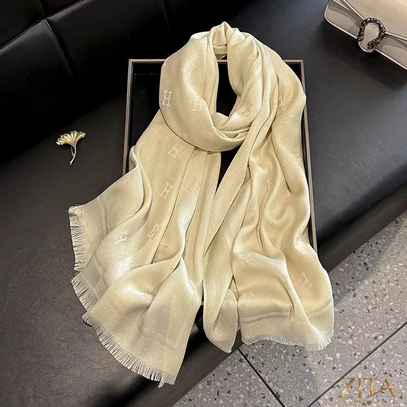 Raw hem scarf by Trendsi, featuring soft fabric with frayed edges, styled for a casual, boho-inspired look.