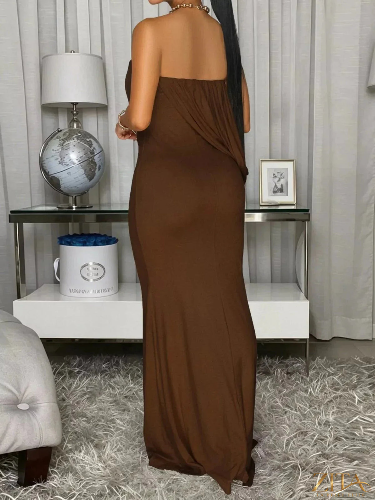 Elegant strapless draped maxi dress by Trendsi featuring flowing fabric and a fitted bodice for a stylish, sophisticated look.