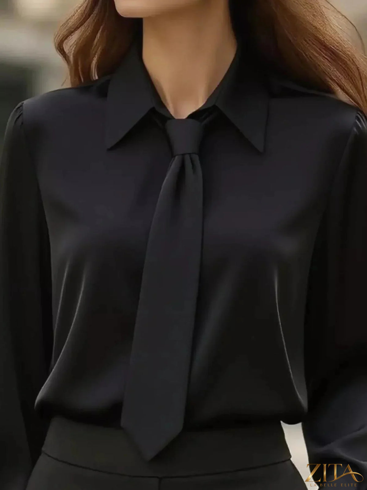 Zita La Belle Elite tie-neck long sleeve blouse with ruffled cuffs and elegant design, shown in a stylish fabric.