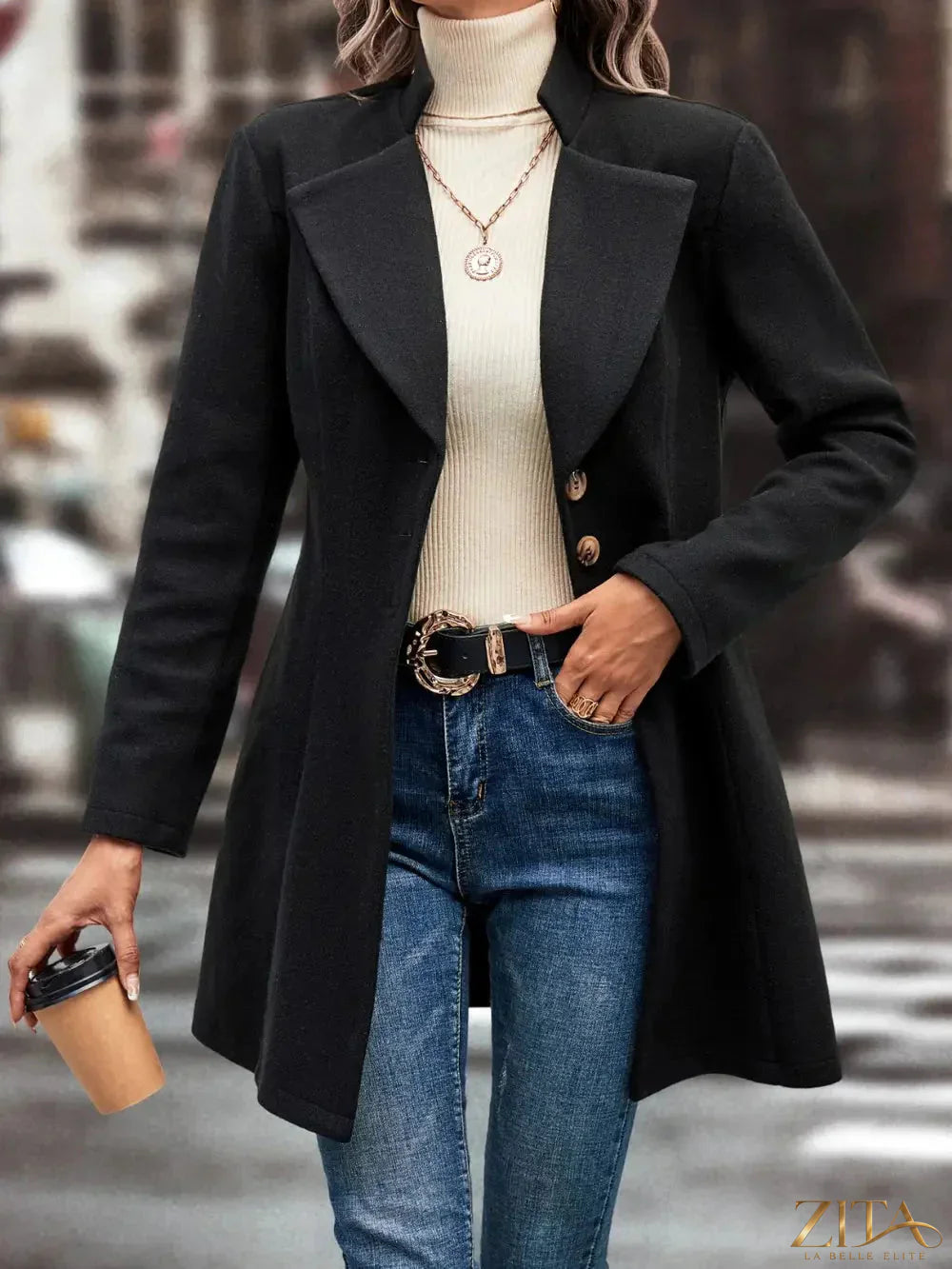 Zita La Belle Elite button-up longline coat in neutral fabric, shown on a model with a collar and front button closures.
