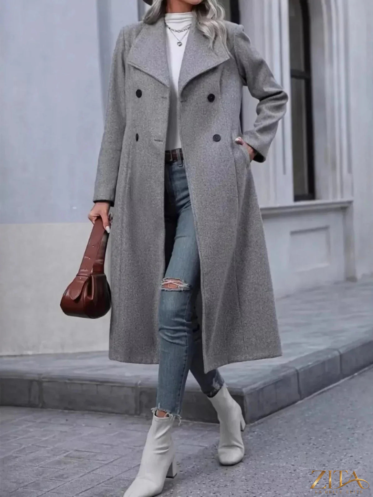 Zita La Belle Elite double-breasted longline overcoat in neutral fabric, showing its tailored fit and elegant lapels.