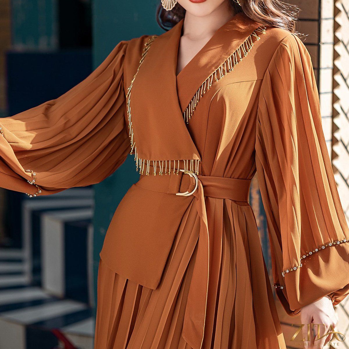 Zita La Belle Elite hand-beaded V-neck pleated maxi gown with bubble sleeves and crystal embellishments, elegant and flowing.