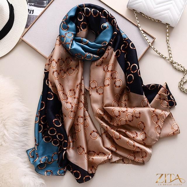 Luxury long printed silk scarf shawl by Zita La Belle Elite, featuring vibrant patterns and a soft, elegant fabric.