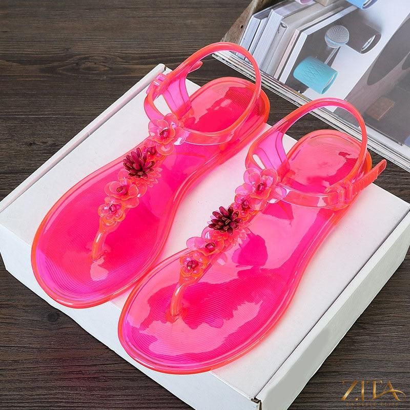 Women’s Zita La Belle Elite Flower T-Strap Flat Thong Sandals with breathable material, floral design, and slip-resistant sole for summer wear.