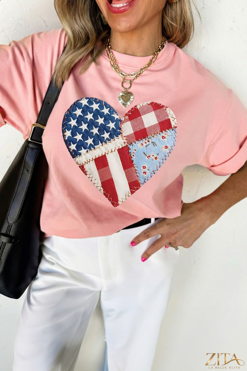 Red and white patriotic heart round neck T-shirt from Trendsi, featuring a bold heart graphic and comfortable fit.