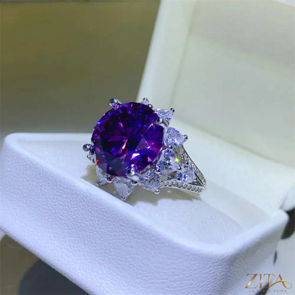 Sterling silver flower-shaped ring with a 10-carat moissanite gemstone, featuring intricate floral design and sparkling brilliance.
