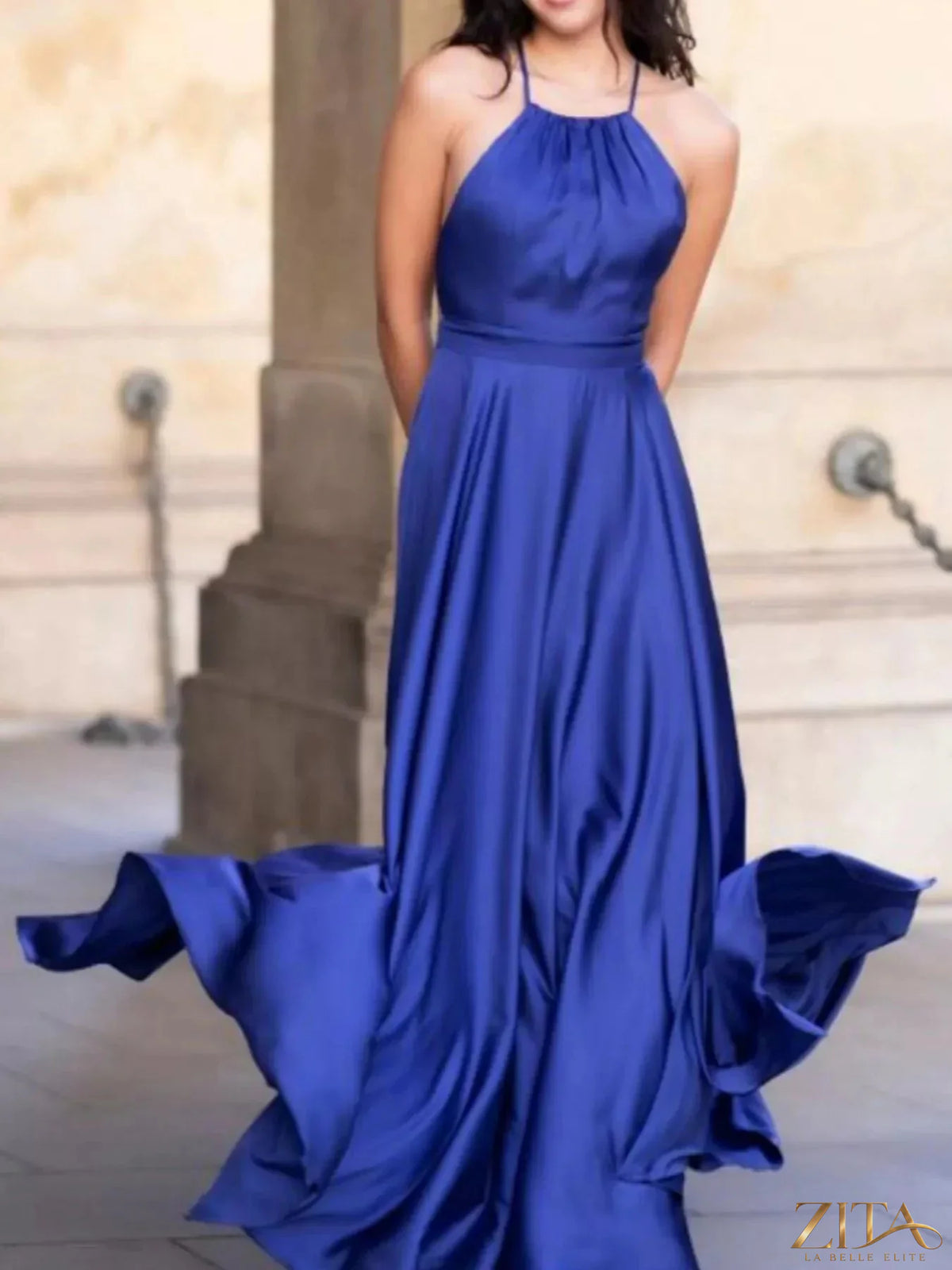 Zita La Belle Elite halter neck slit maxi dress in flowing fabric, sleeveless design with a high slit and elegant silhouette.