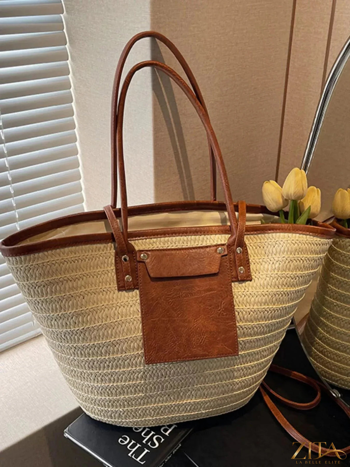 Zita La Belle Elite woven straw tote bag with leather handles and spacious interior, perfect for beach or casual outings.