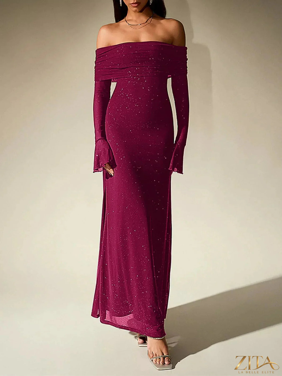 Sparkling glitter off-shoulder maxi dress by Zita La Belle Elite, featuring a flowing silhouette and elegant off-the-shoulder design.