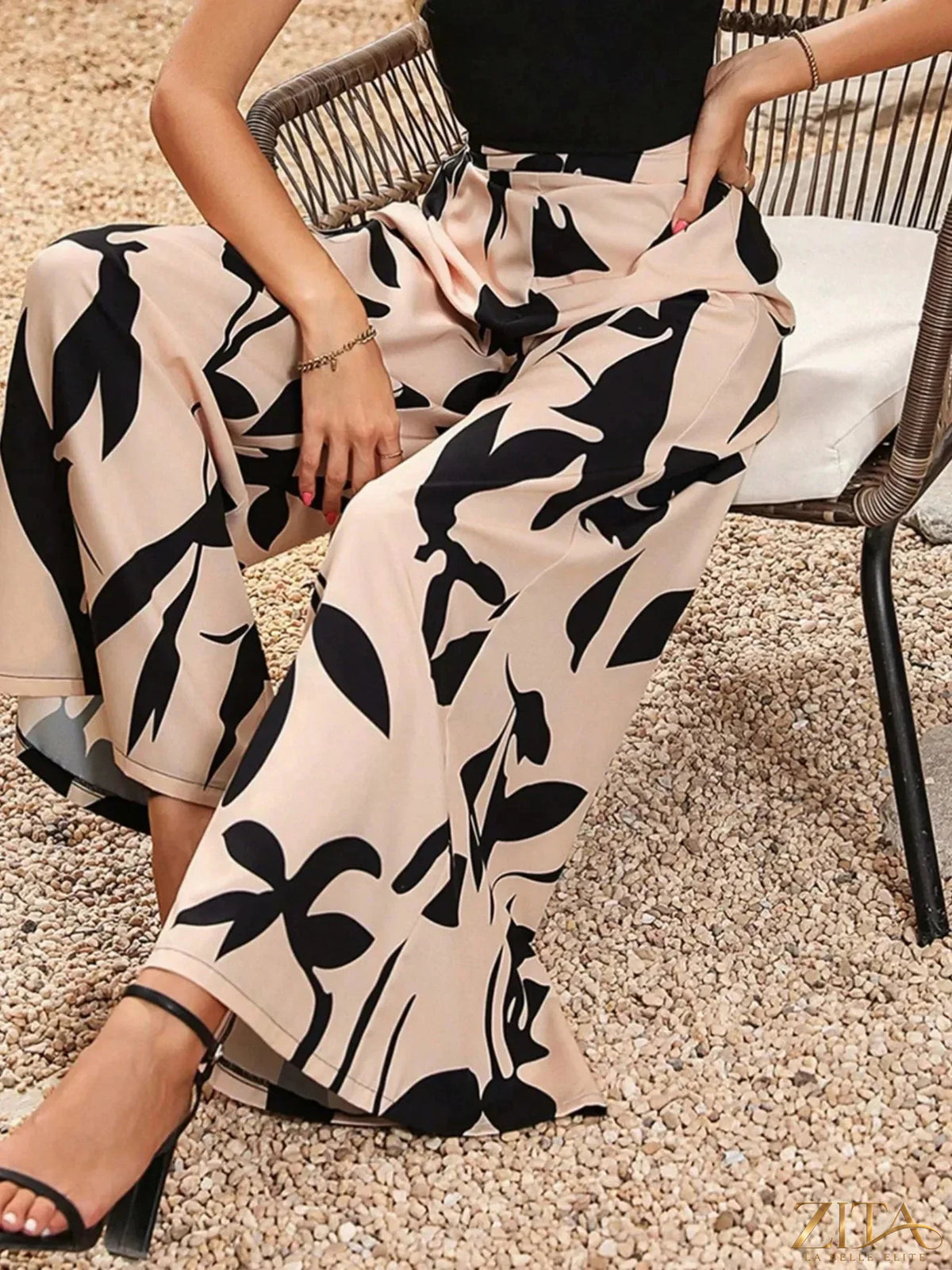 Zita La Belle Elite printed wide-leg pants with colorful floral pattern and flowing fabric, full-length view.