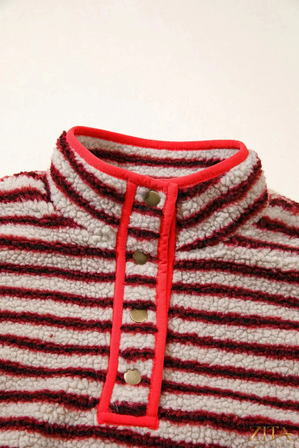 Striped fuzzy colorblock sweatshirt with button placket from Zita La Belle Elite, featuring soft texture and vibrant striped pattern.