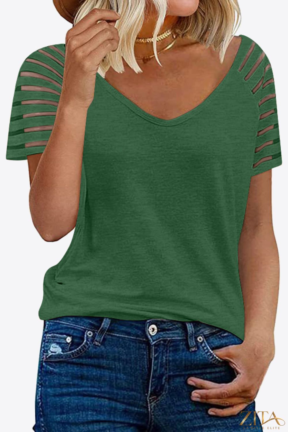 Black V-neck raglan sleeve tee by Trendsi with contrasting white sleeves and relaxed fit, displayed on a hanger.