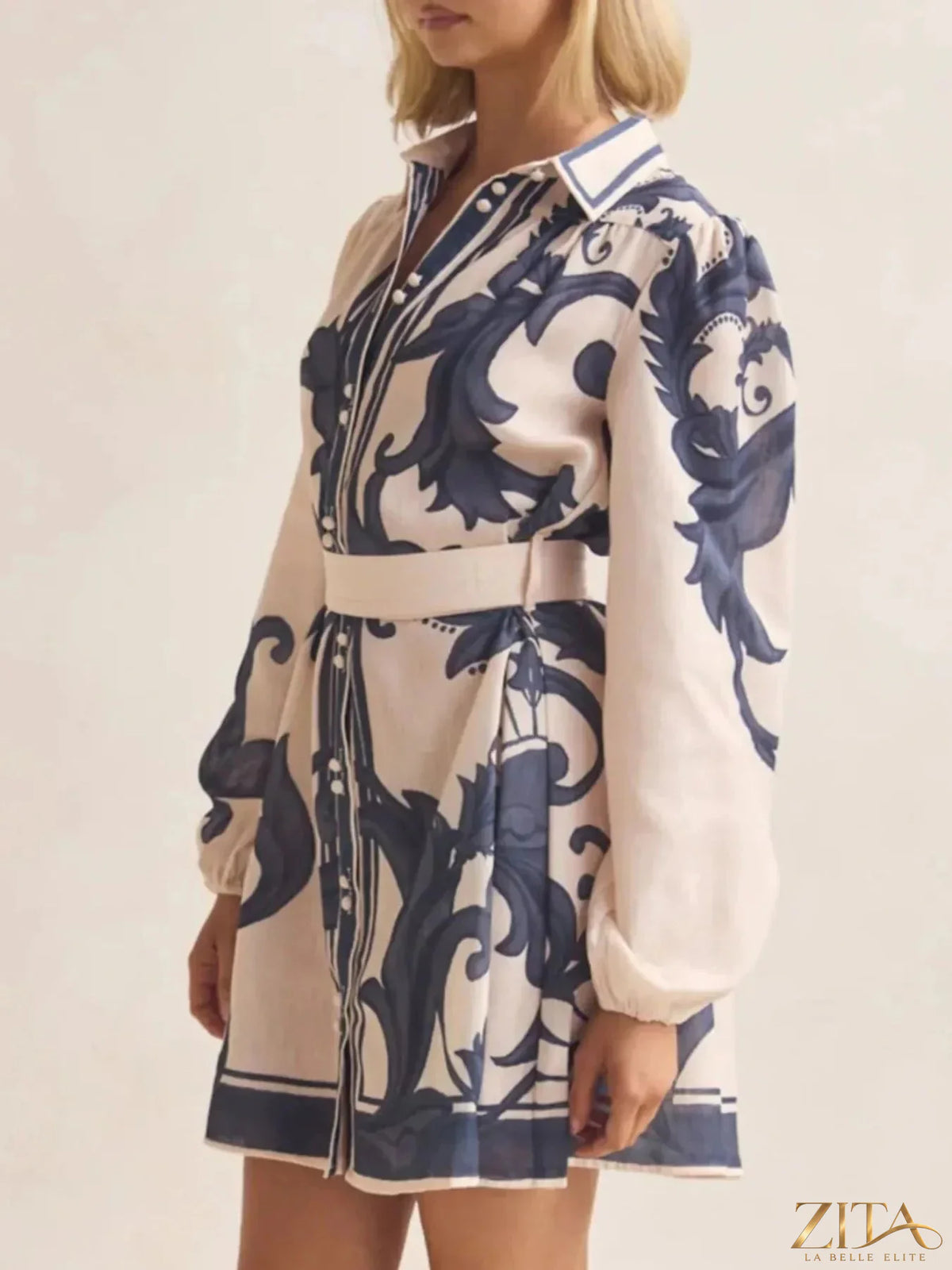 Printed long sleeve shirt dress by Trendsi featuring a stylish, flowy design with a patterned fabric and classic collar.
