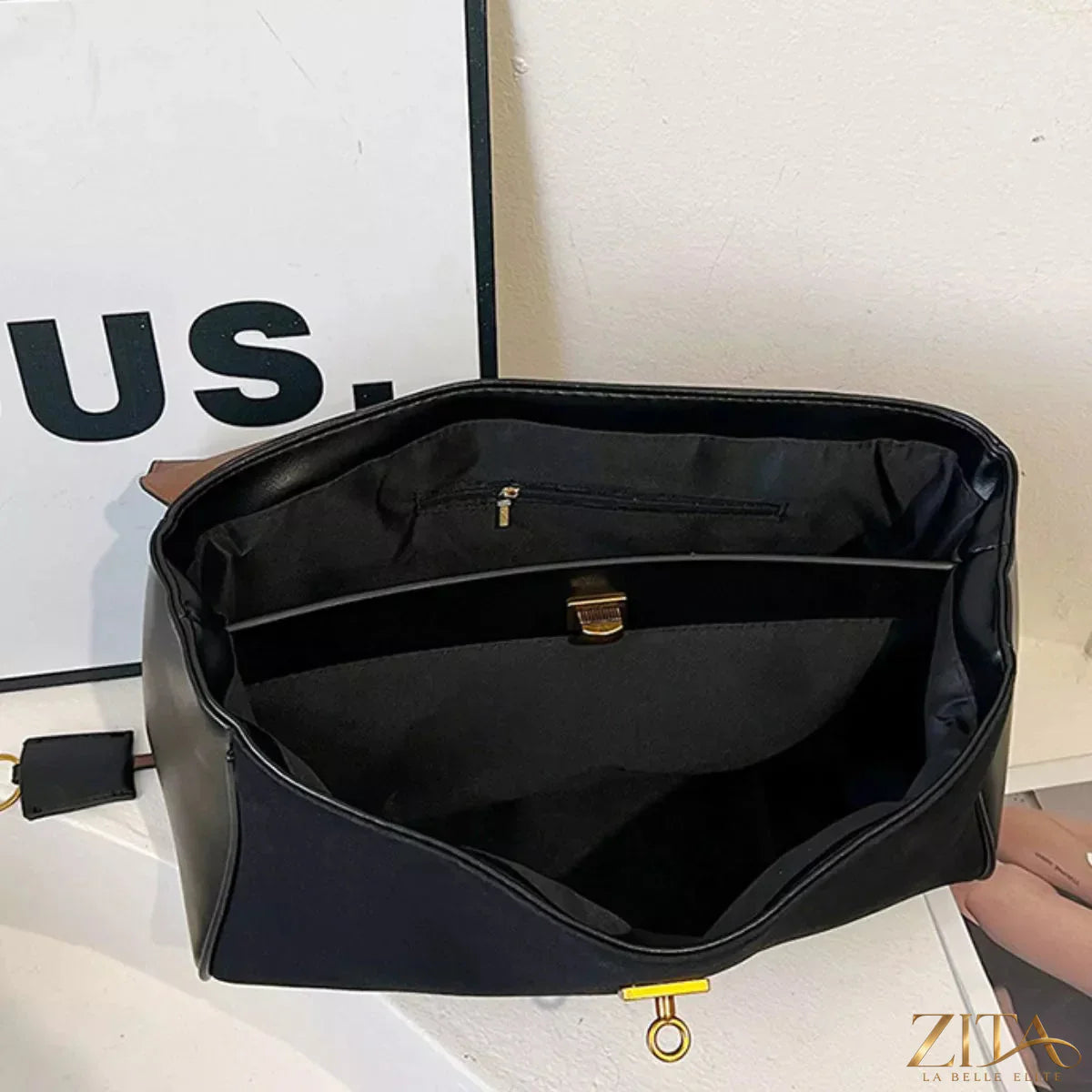 Trendsi PU leather shoulder bag with sleek design, featuring a zipper closure and adjustable strap, perfect for casual or formal use.