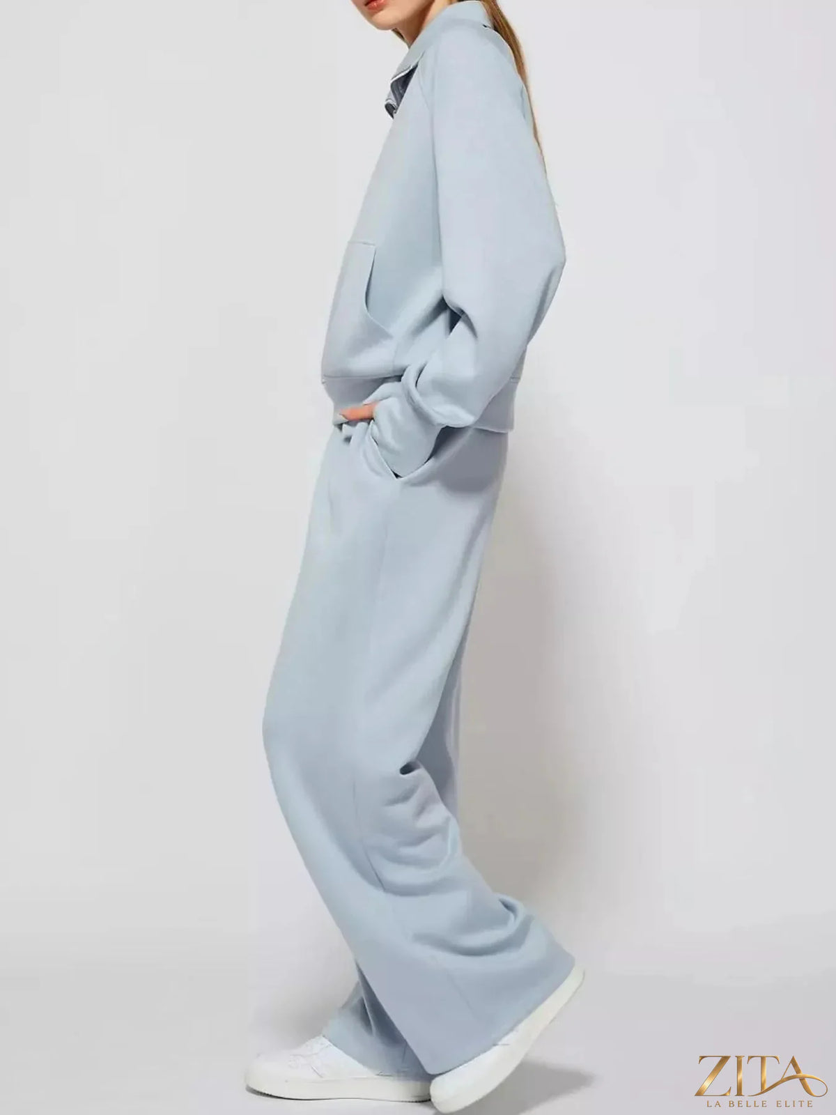 Zita La Belle Elite half-zip sweatshirt with matching wide-leg pants set, in soft fabric, displayed on a hanger.