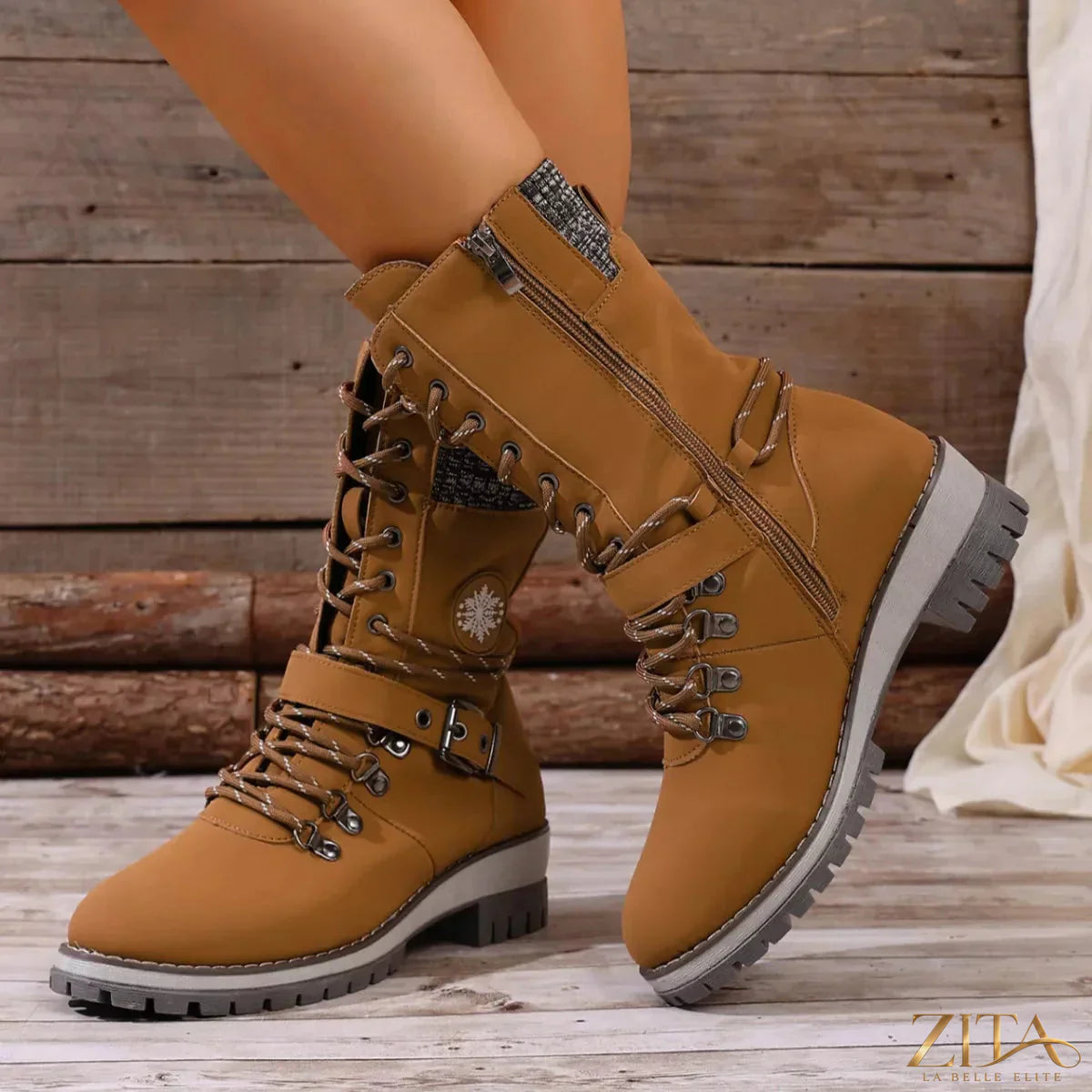 Black lace-up ankle combat boots with chunky soles and metal eyelets from Trendsi, styled with rugged, edgy fashion.