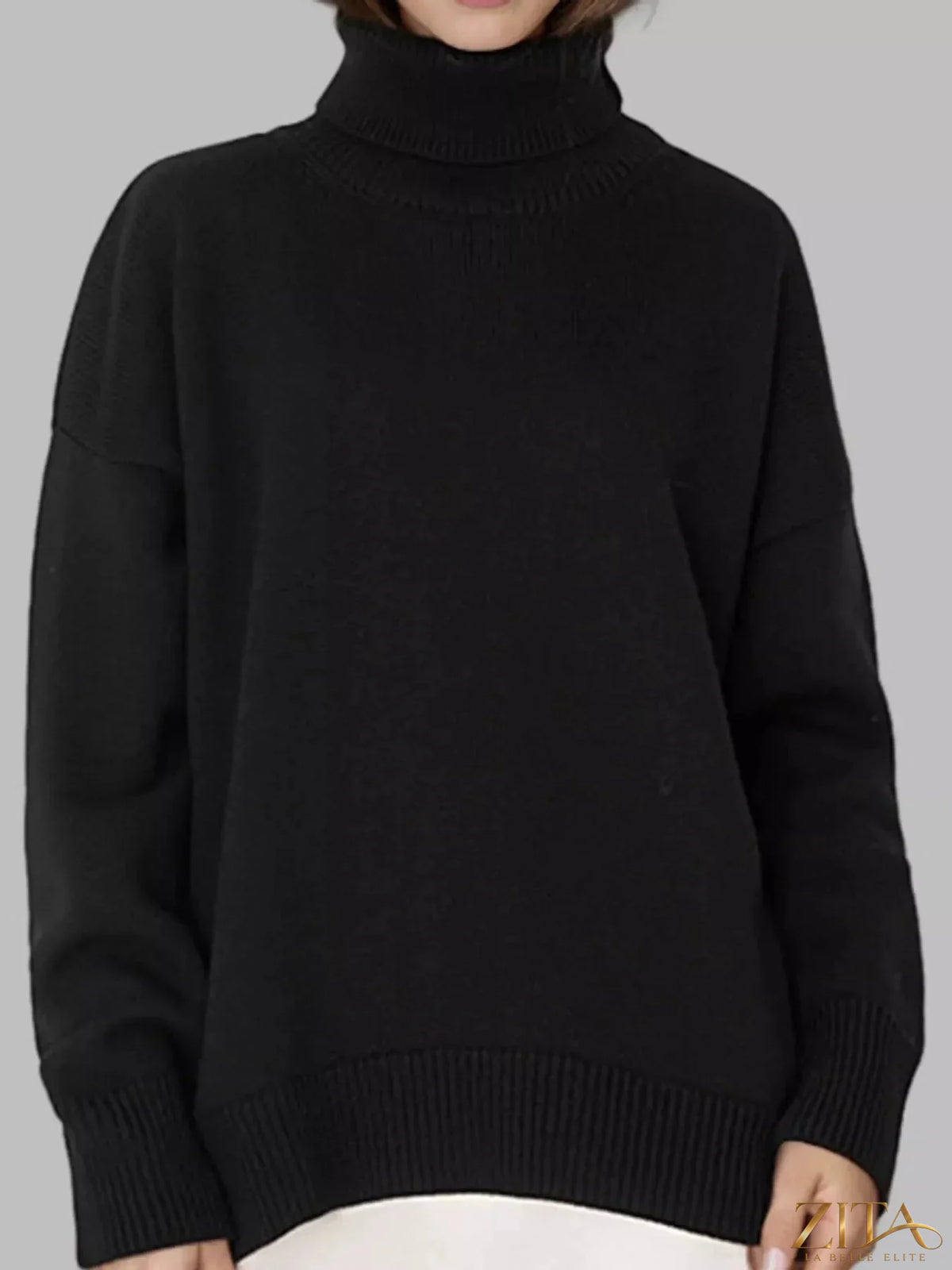 Zita La Belle Elite turtleneck dropped shoulder sweater in soft knit, shown in a cozy close-up with ribbed collar and relaxed fit.
