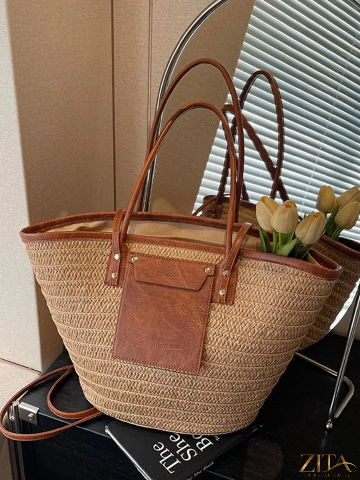 Woven straw tote bag by Zita La Belle Elite with leather handles and spacious interior, perfect for casual outings.