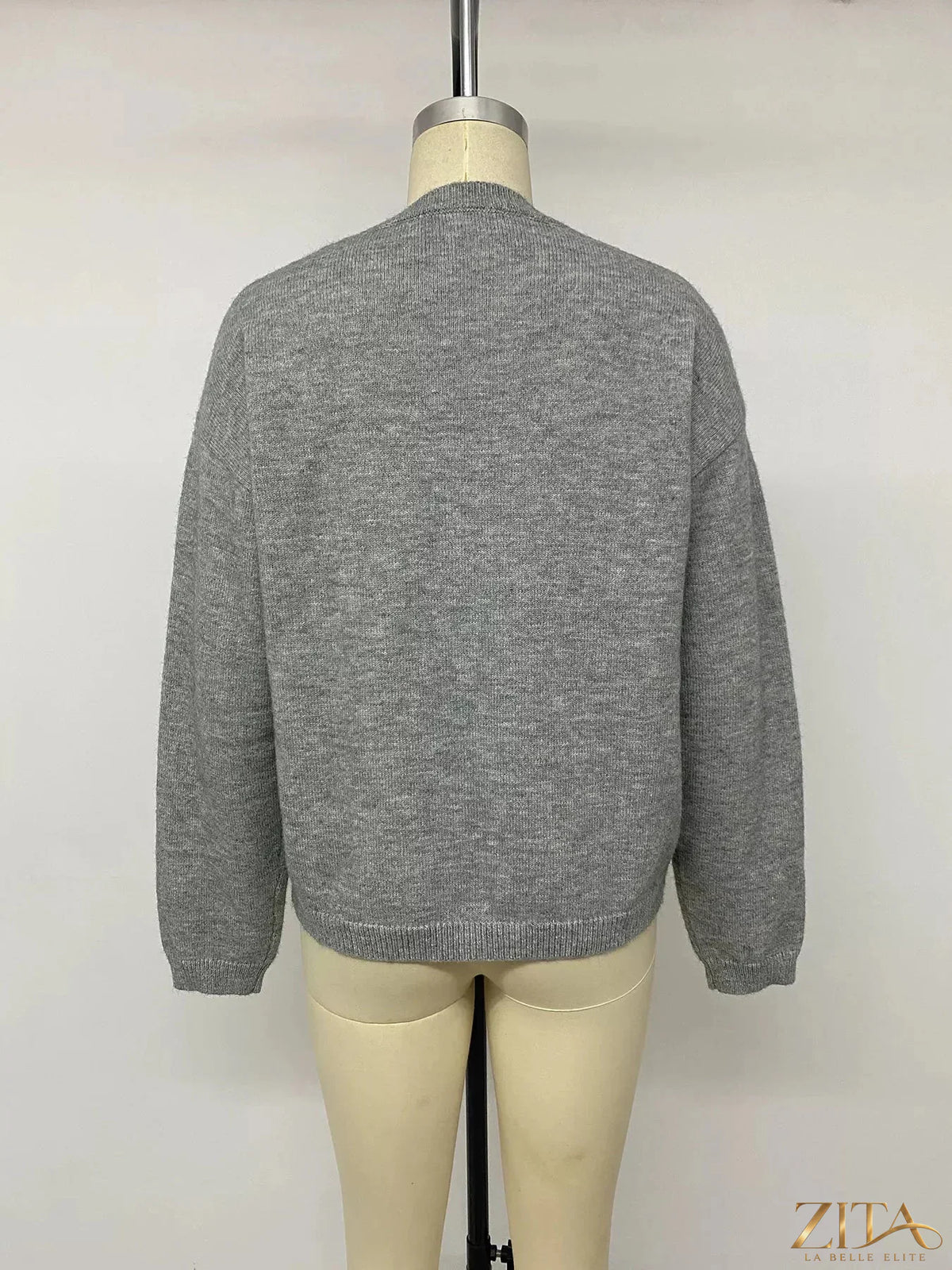 Star-patterned dropped shoulder sweater by Zita La Belle Elite, featuring a cozy knit with celestial star designs and relaxed fit.